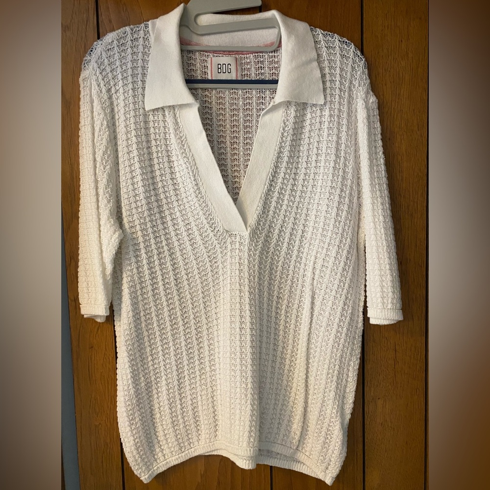 Urban Outfitters (BDG) white polo style knit shirt. Size medium.
